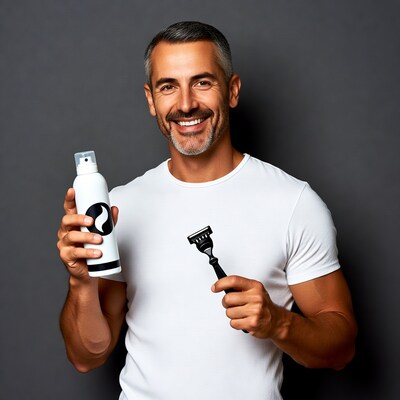 Smiling man holding shaving cream and razor