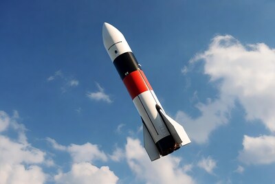 Rocket launching into blue sky