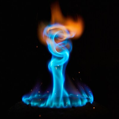 Blue swirling flame on black background