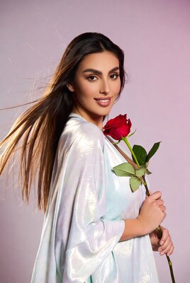 Woman holding red rose