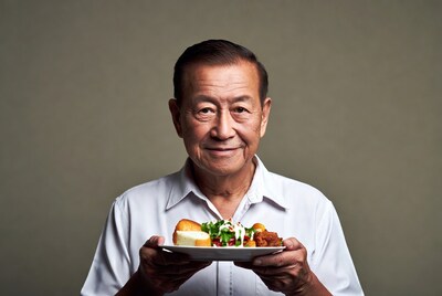 Elderly Asian man holding plate of food