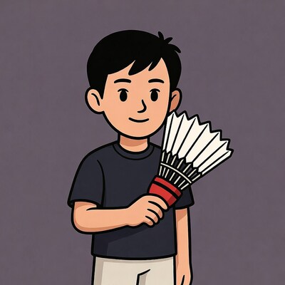 Asian boy holding badminton shuttlecock