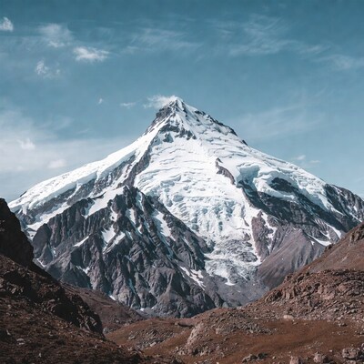 Snowy Mountain Peak Under Blue Sky
