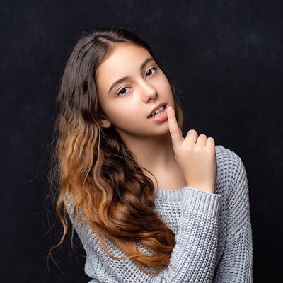 Girl finger on lips