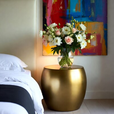 White and pink flowers on gold bedside table