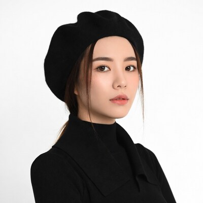 Asian woman in black beret