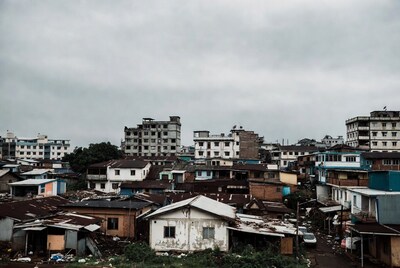 Urban slum with rundown buildings under cloudy sky