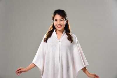 Asian woman in white batwing cape