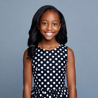 African-American girl in polka dot dress