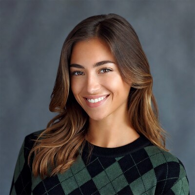Smiling woman in green plaid sweater