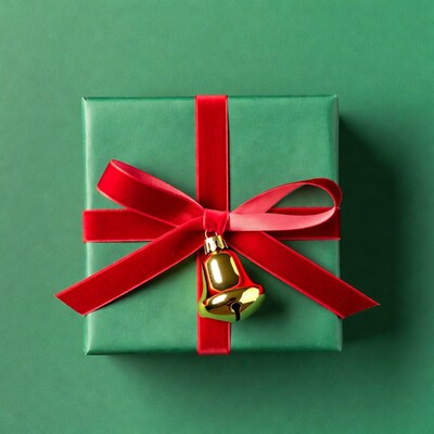Green gift box with red ribbon