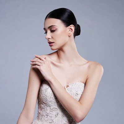 Woman in lace strapless gown profile