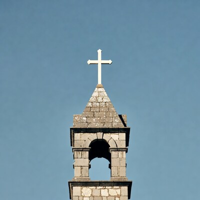 Stone Church Bell Tower with Cross