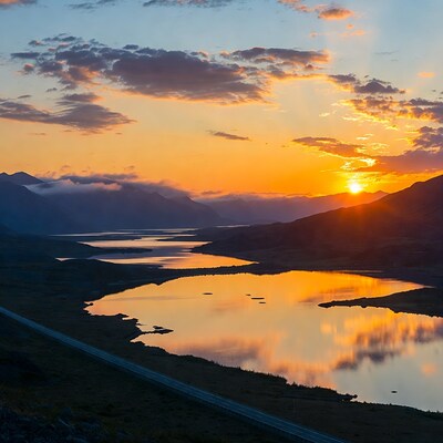 Sunset over mountains and river
