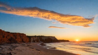 Sunset over red cliffs beach