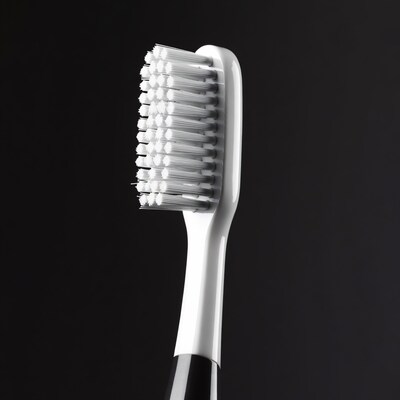 White toothbrush on black background