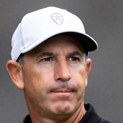 Man wearing white Koenigsegg cap