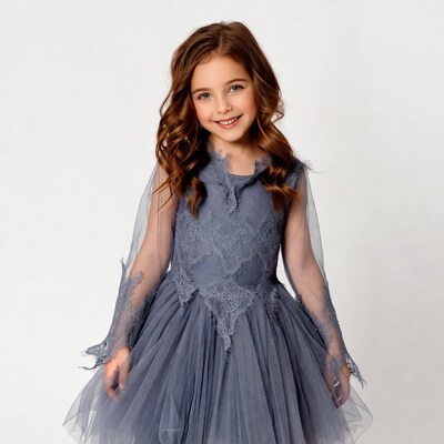 Girl in gray lace dress smiling