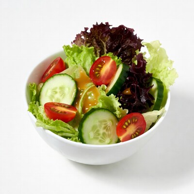 Fresh salad with tomatoes cucumbers dressing