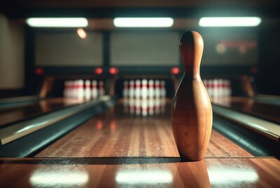 Wooden bowling pin on lane