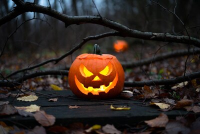 Jack-o-lantern in autumn forest