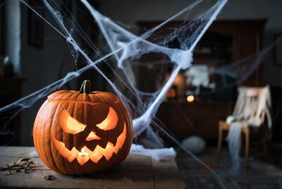 Lit Jack-o-Lantern with Spider Webs