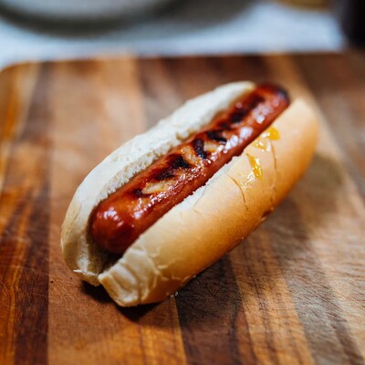 Grilled hot dog with mustard