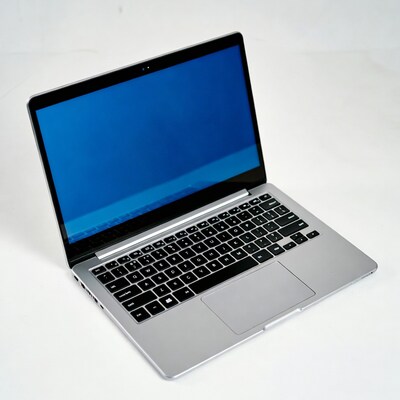 Silver laptop with blue screen