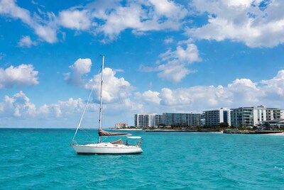 White sailboat anchored in turquoise sea