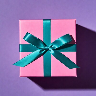Pink gift box with teal ribbon