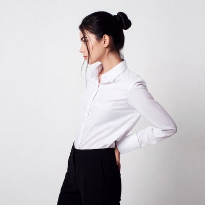 Asian woman in white shirt black pants profile