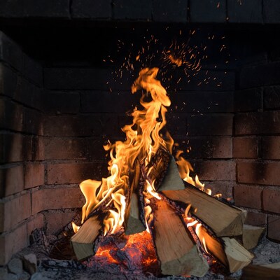 Blazing fire in brick fireplace