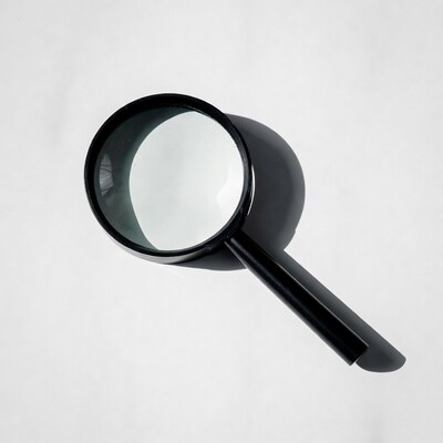 Black Magnifying Glass on White