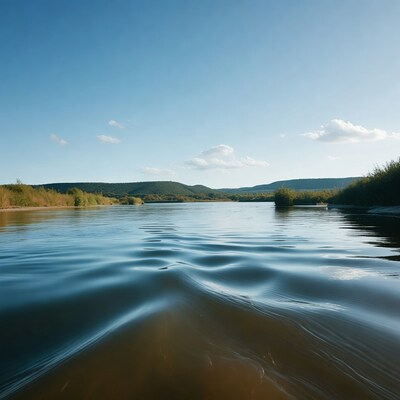 River boat wake with mountains