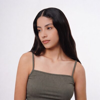 Latina woman in green tank top profile