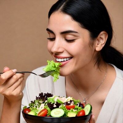 Woman eating fresh salad