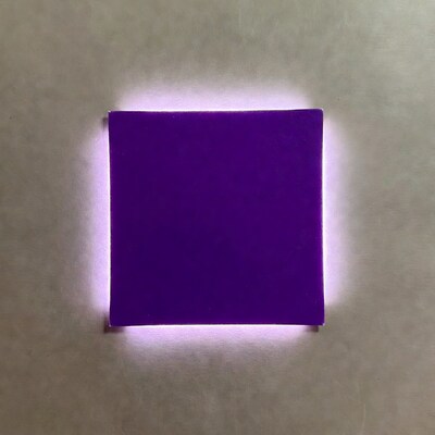 Purple square glowing on beige background