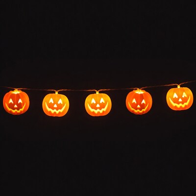 Jack-o-lantern lights string on black background