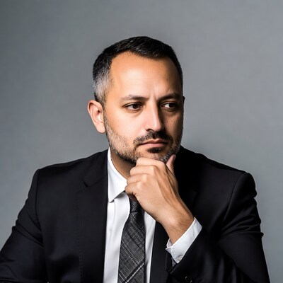Man in suit thinking with hand on chin