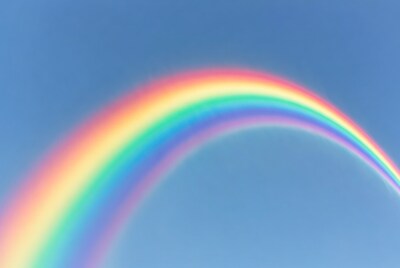 Vibrant Rainbow in Blue Sky