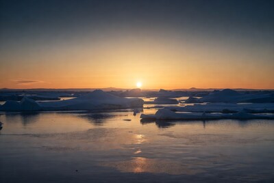 Sunset over Arctic icebergs