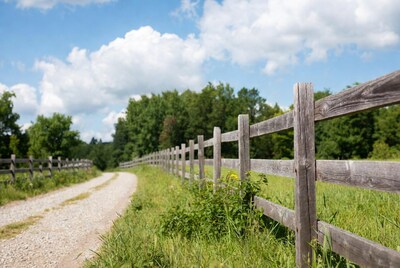 Wooden fence along gravel path