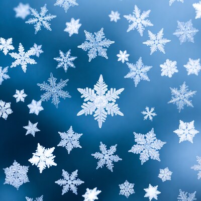 Snowflakes falling on blue background