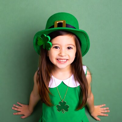 Asian girl in leprechaun costume smiling