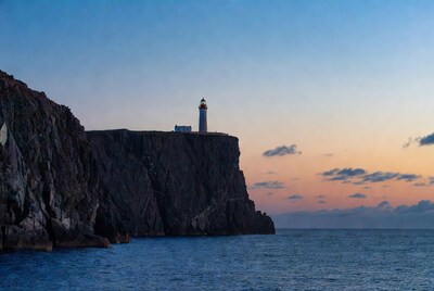 Lighthouse on Cliff at Sunset
