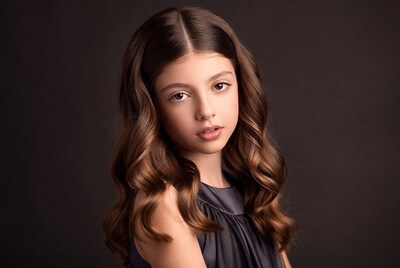 Young girl with curly brown hair