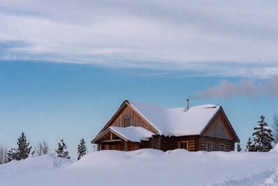 Log cabin in snowy landscape