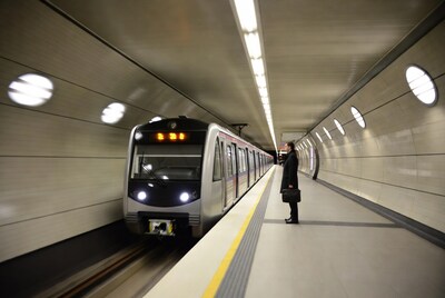 Man waiting for subway train in tunnel
