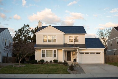 Beige Two-Story House with Dark Blue Roof