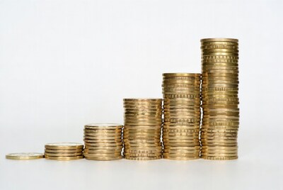 Stacks of gold coins forming bar graph